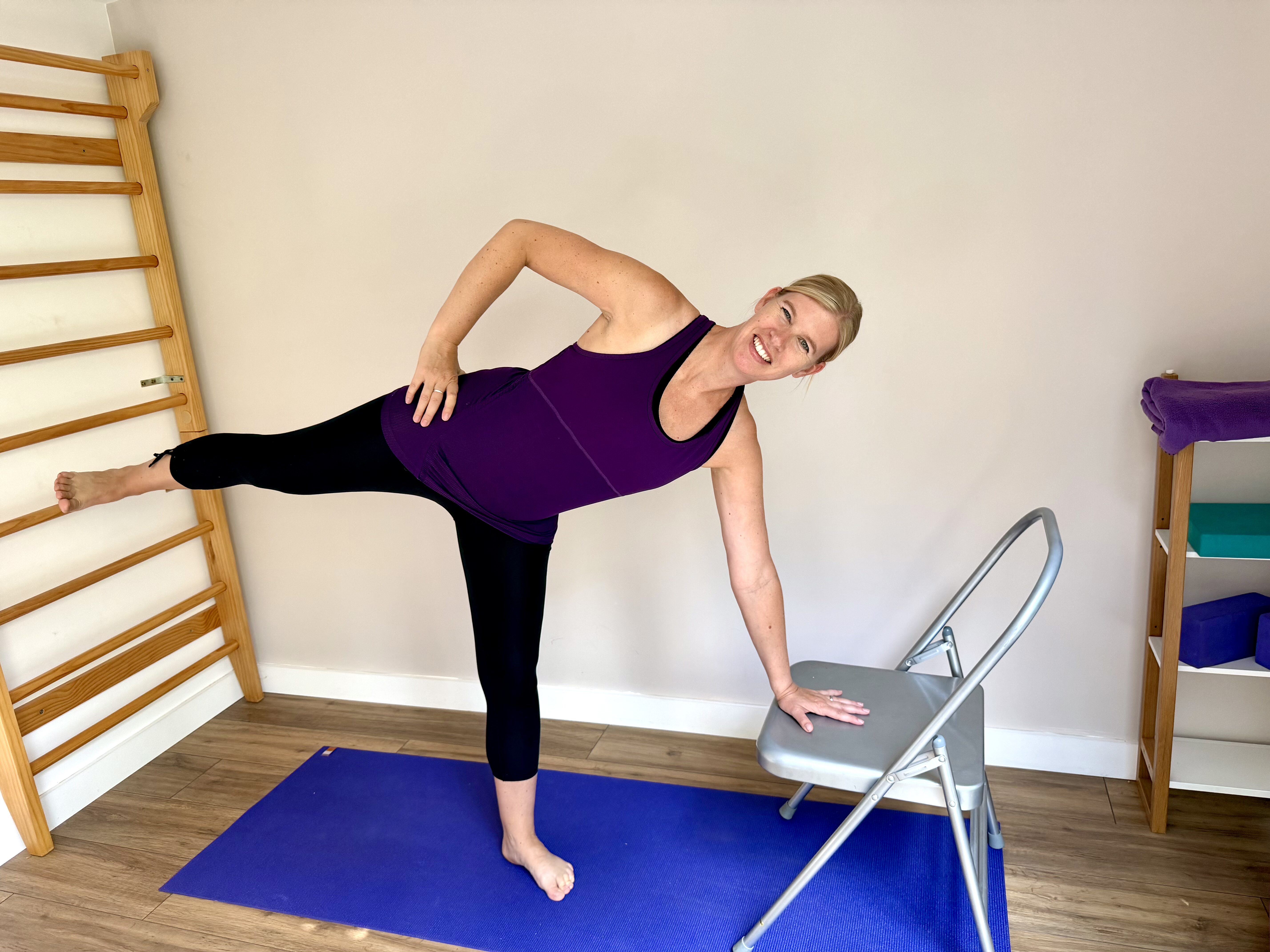 Love Your Spine - Halfmoon Christine demonstrating half moon pose with chair